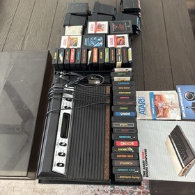 Vintage Atari 2600 Console With 83 Games and (8 Intellivision Games) Not Tested