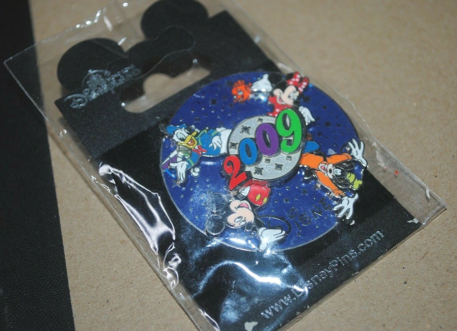 2009 Disneyland Hong Kong spinning pin with Mickey, Minnie, Donald, Goofy, MIP