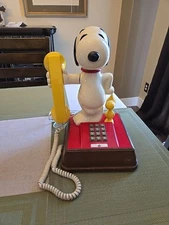 1976 The Peanuts Snoopy and Woodstock Phone-Head Turning Push Button Telephone.