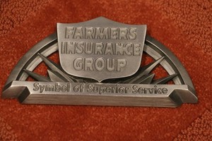 FARMERS INSURANCE METAL EMBLEM