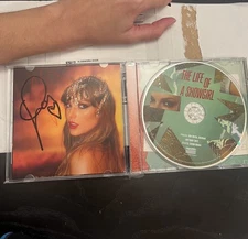 Taylor Swift Signed TLOAS CD photo #1