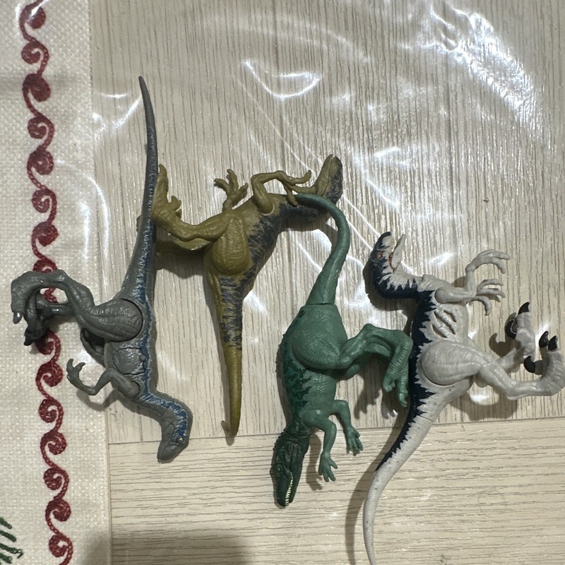 Lot of 4 Jurassic world Toy Action Figures - Green, Gray, White/Black, Brown