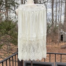 Poema white lace skirt with built in slip underneath, elastic wasit sz L