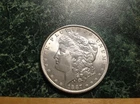 1887 Morgan Head Silver Dollar (orange)