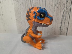 Untamed T-Rex Interactive Dinosaur by Fingerlings Scratch Orange  Wowwee 2017