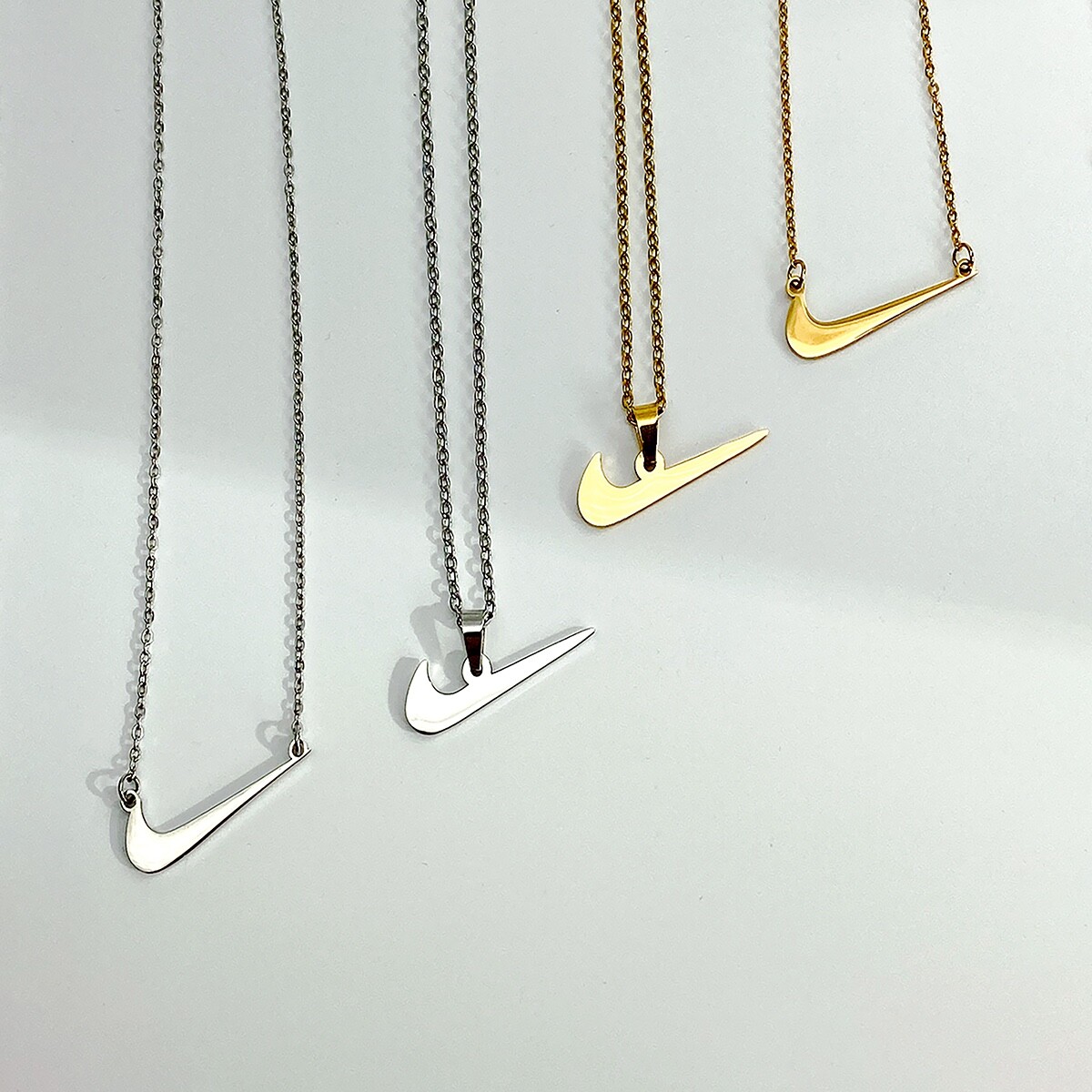 NIKE SWOOSH Halskette klein gold silber neu Geschenk