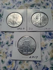 three silver one ounce eagles BU .999 2020 and two 2017