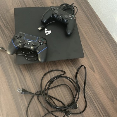 Sony PlayStation 4 Pro 1TB Game Console - Jet Black With Two Wired Controllers
