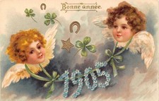 L174 New Year Greetings 1905 Cherubs shamrock horseshoe luck embossed postcard
