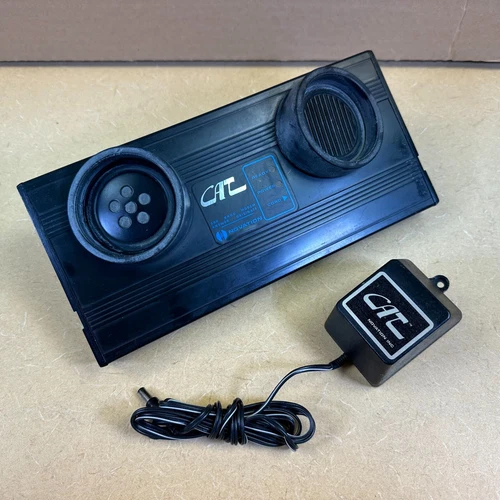Novation CAT Modem used with early Apple Computers, with charger, powers on
