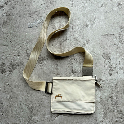 A-COLD-WALL* Beige Solid Crossbody Bag Zip Closure Adjustable Strap Pockets
