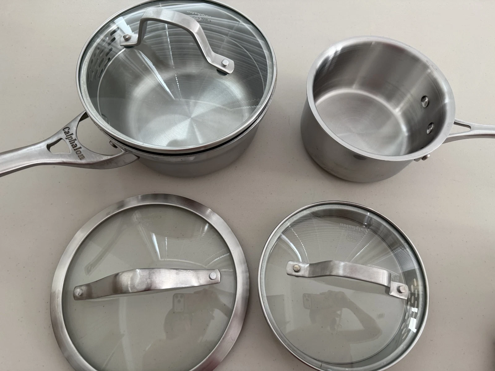 Lot 2 Calphalon Stainless Steel Pots and 3 lids (Sh11)
Opens in a new window or tab