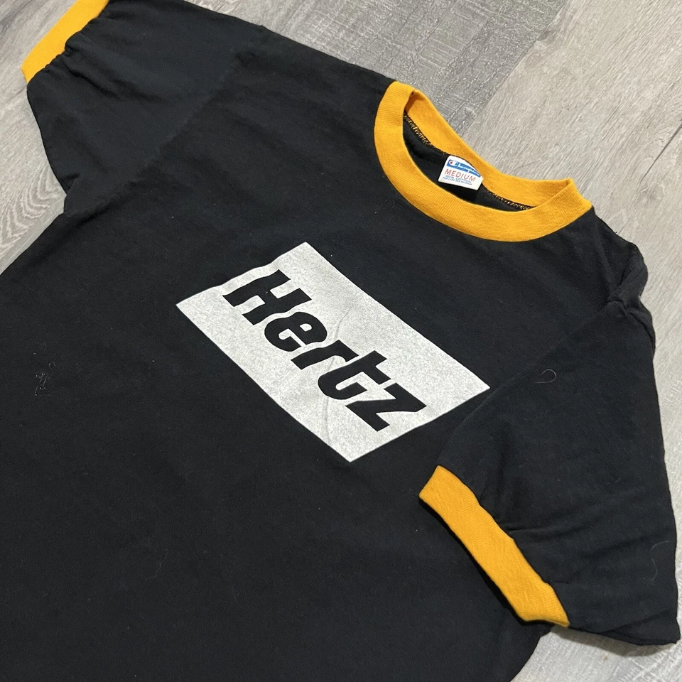 Camiseta de colección Champion Blue Bar negra/amarilla HERTZ #1 AÑOS 70 EE. UU. Ringer alquiler de auto Foto 2 de 4