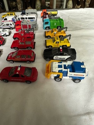 lots of 21 toys service vehicles police, fire, transportation, construction etc