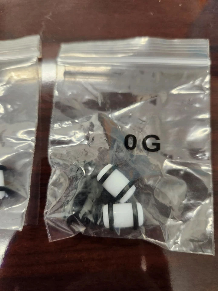 Kit de estiramiento de oreja de tabique de plástico blanco y negro de 6 g a 00 g 10 mm Foto 4 de 4