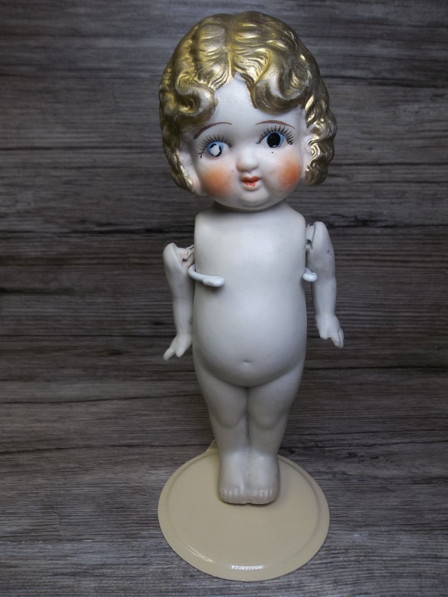 antique Bisque doll gold hair moveable arms made in Japan we think
