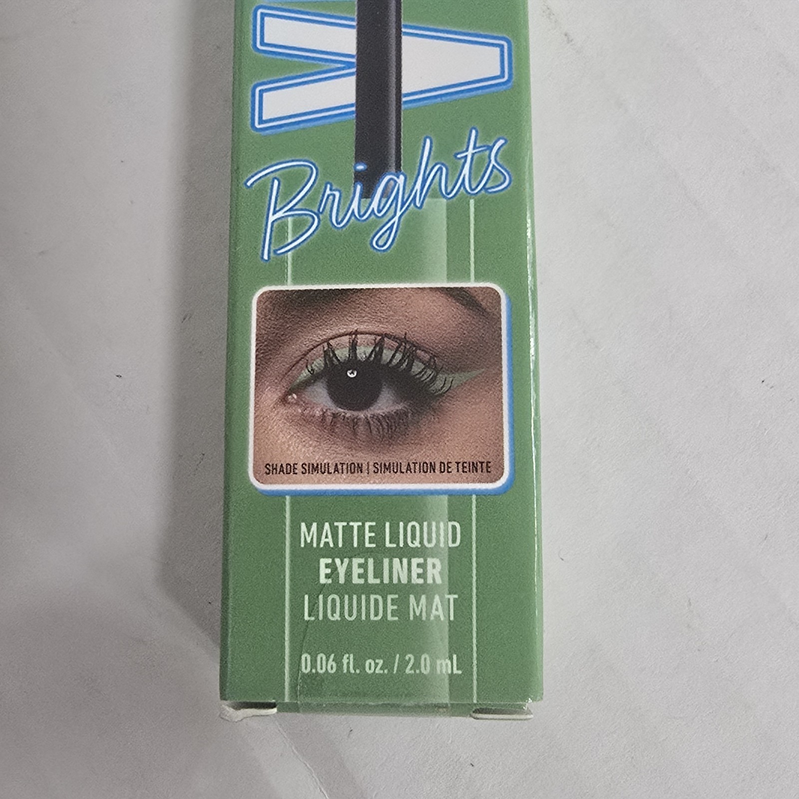 NYX Colored Liquid Eyeliner Ghosted Green VBLL02 box with black-brown eye look and blue NYX logo.