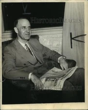 1943 Press Photo Lister Hill, Alabama Senator, Seated, Holding Newspaper
