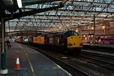 Photo 6x4 Carlisle Railway Station A Network Rail train sits in a siding. c2015