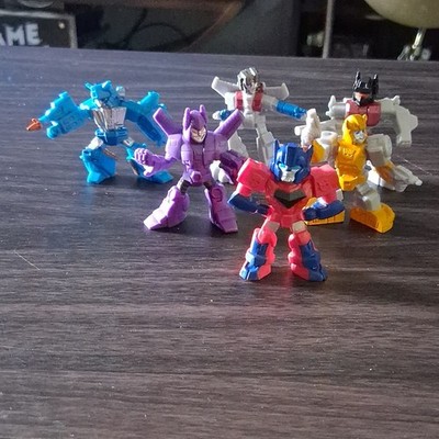 This listing is for a lot of 6 Transformers Tiny Titans collectible minifigures