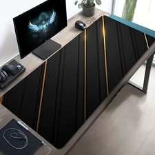 A Large Gaming Mouse Pad Featuring a Black An...