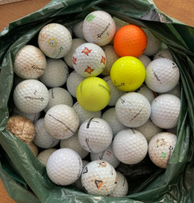 Lot of 55 used TaylorMade Golf balls, mostly white, a few colored