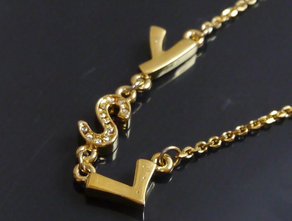 Authentic Yves Saint-Laurent necklace logo vintage Metallic