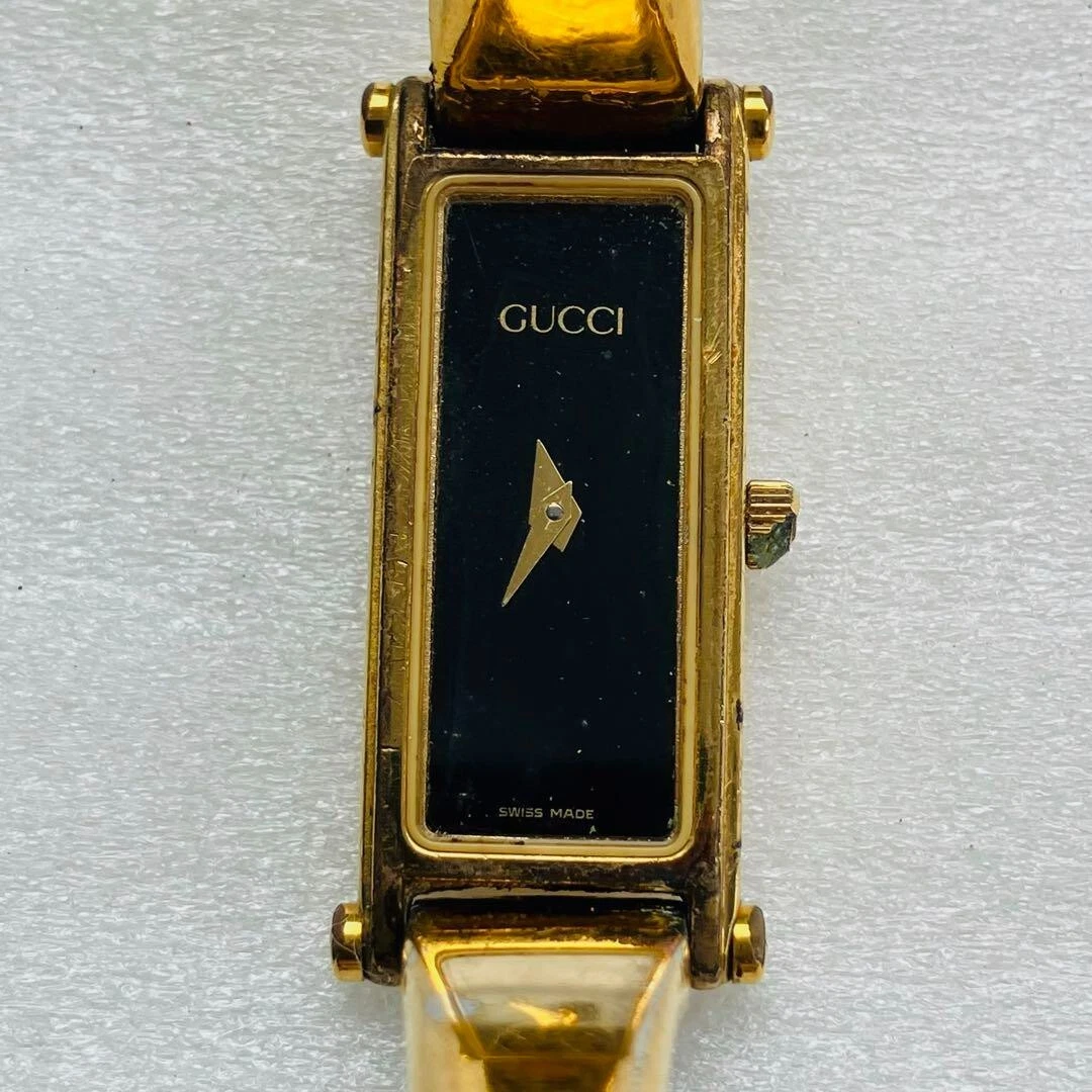 Très bonne montre pour femme GUCCI 1500 or noire fabriquée en Suisse vintage du Japon