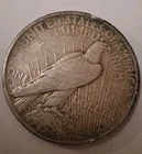 1935 S Peace Dollar. Dark Obverse Album Toned,  Better Date.