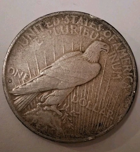 1935 S Peace Dollar. Dark Obverse Album Toned,  Better Date.