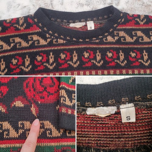 Black knit men's sweater size small with red, brown, and green floral and tree patterns, cream collar, and white size S label.