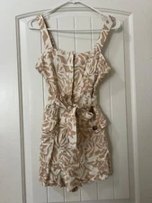 Olivaceous Romper linen. Tan and white. Size Small. New with tags 