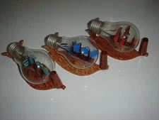 hand made wooden miniature ship in a light bulb