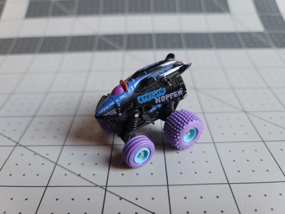 T1 MICRO MACHINES STEALTH HOPPER SPIN & STEER MONSTER TRUCK GALOOB - Image 2 of 3