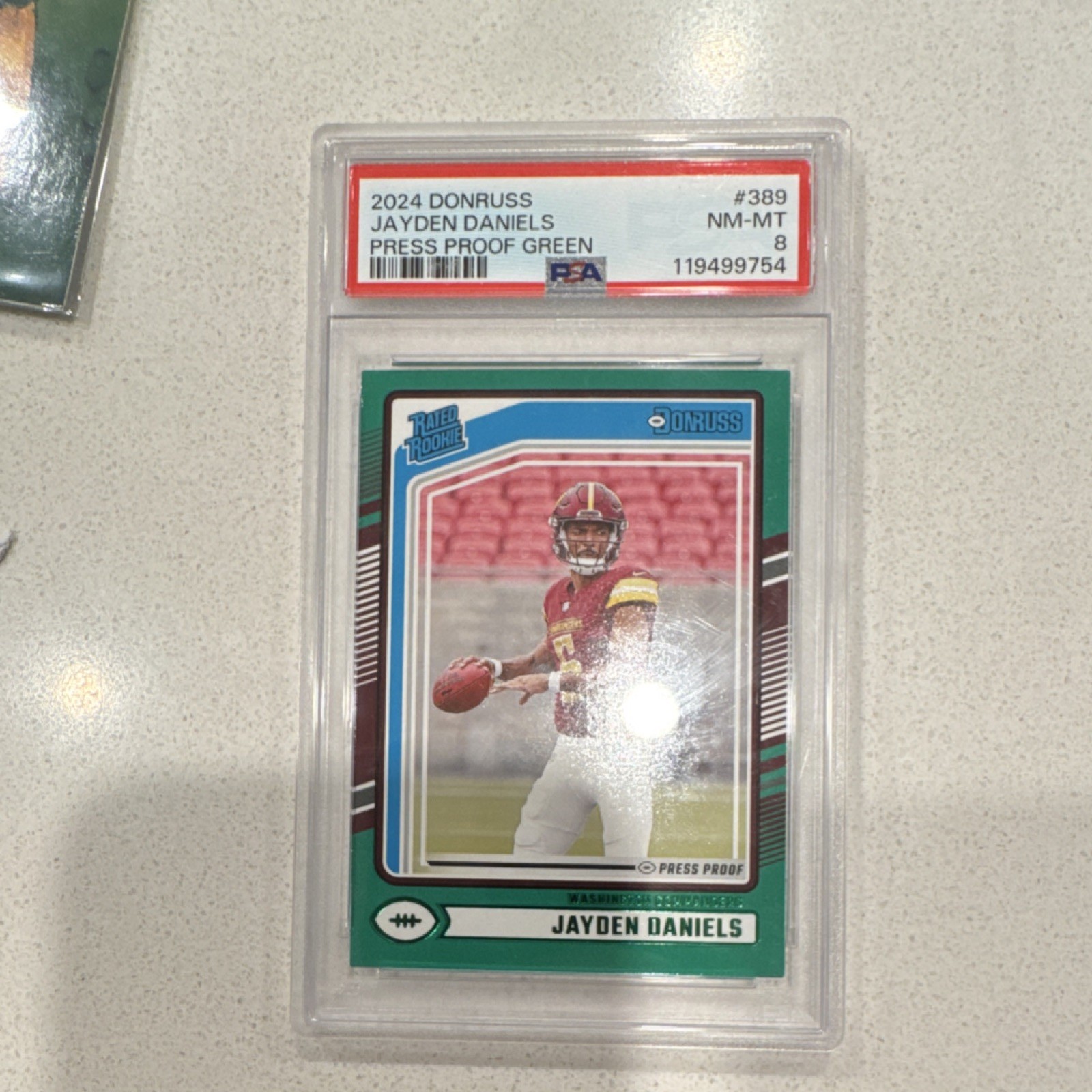 2024 Panini Donruss Rated Rookie Jayden Daniels #389 Press Proof Green PSA 8