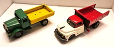 Two Japan Tin Friction Trucks