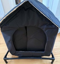 Brand new cat house ,black , fully weatherproof, insulated, for inside or out .