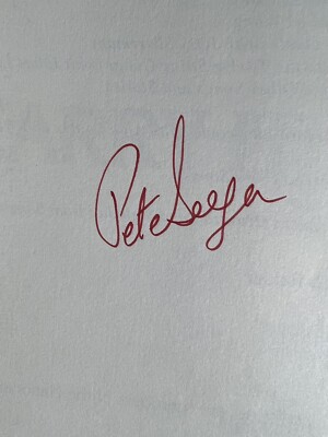 Pete Seeger Autograph in His Book Carry It On!