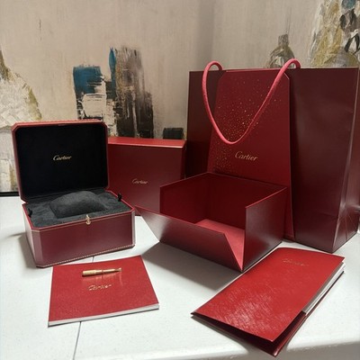 Cartier box empty, screw driver, Bag and book