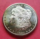 1884-CC MORGAN SILVER DOLLAR. UNCIRCULATED. HIGH GRADE.