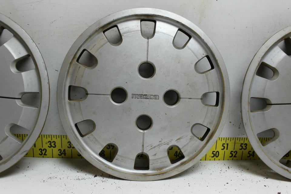 Juego de 4 tapacubos usados OEM G12037170 1986-1987 Mazda 626 363 (3345) Foto 4 de 4