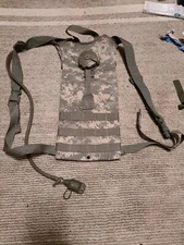 US Military Surplus Camelbak With Carrier. Good Condition But Needs Cleaning 