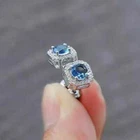 2Ct Round Cut Lab-Created Blue Sapphire Halo Stud Earrings 14K White Gold Plated