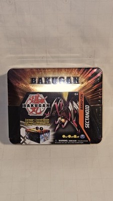 Bakugan Baku-Tin, Sectanoid Premium Collectors Storage Tin w/mystery. New In Pls