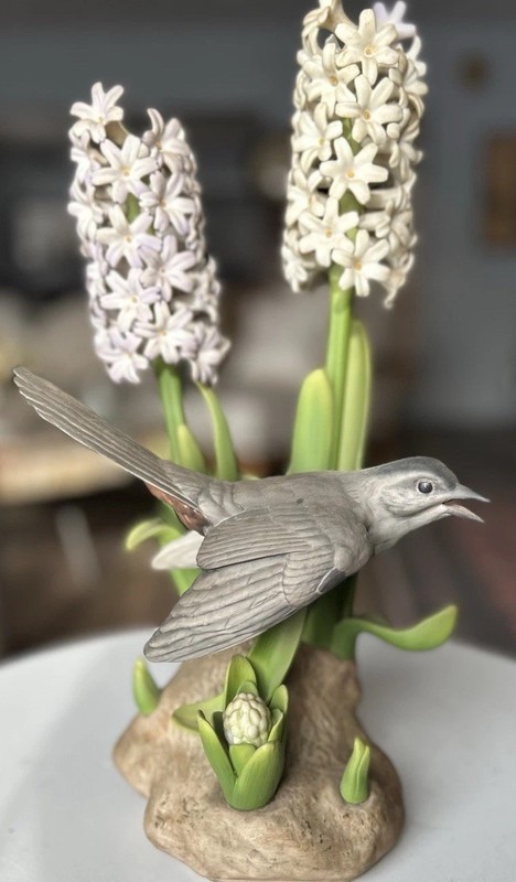 Porcelain sculpture titled 'Catbird with Hyacinths' by Boehm