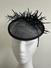 Black hatinator with biot feathers on a headband 