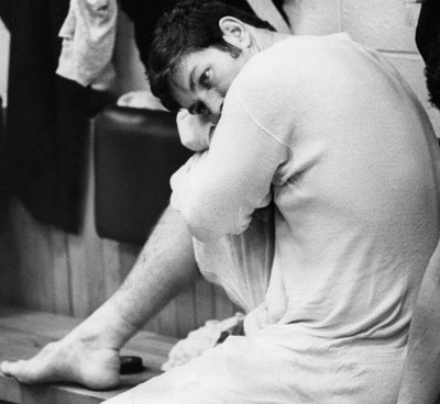 Boston Bruins' Fred Stanfield sits locker room after a game a- Boston Old Photo