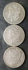1885 O, 1886 O, and 1887 $1 Morgan Silver Dollars