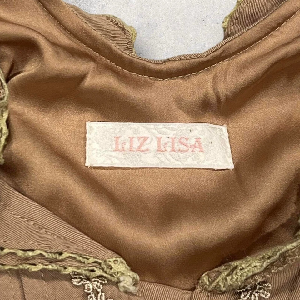 Mono bohemio con volantes Liz Lisa tostado con detalle de encaje Foto 4 de 4