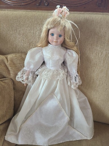 #510- PORCELAIN DOLL BLONDE HAIR BLUE EYES DRESSED IN A LONG WHITE  GOWN